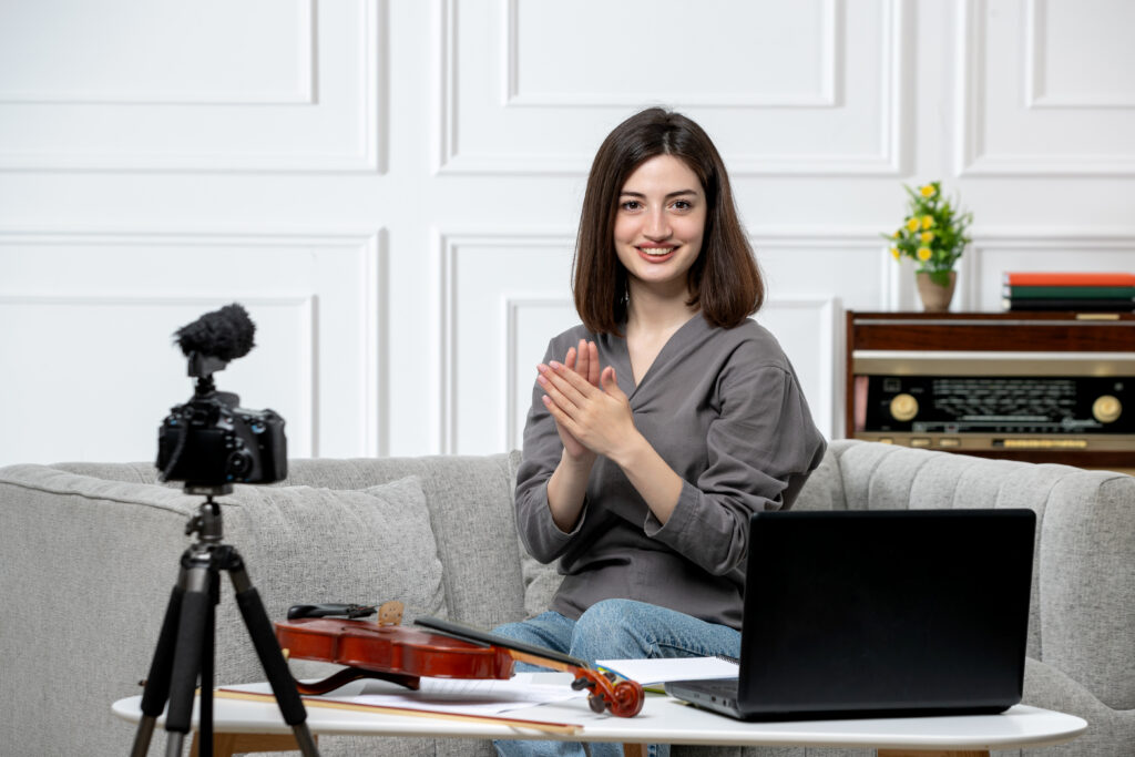 elearning young cute beautiful girl remotely home giving violin classes being teacher